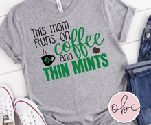 Load image into Gallery viewer, This Mom Runs on Coffee and Thin Mints Graphic Tee